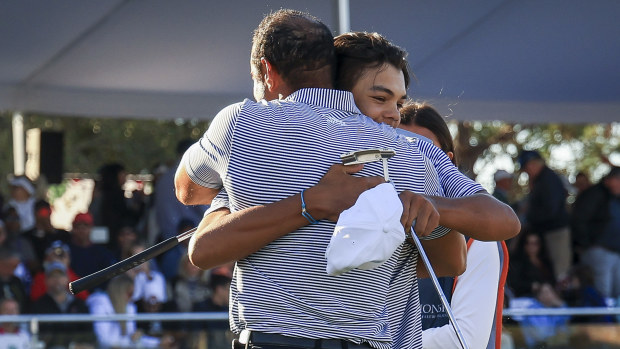 Tiger Woods back on course as he and son Charlie share lead at PNC Championship