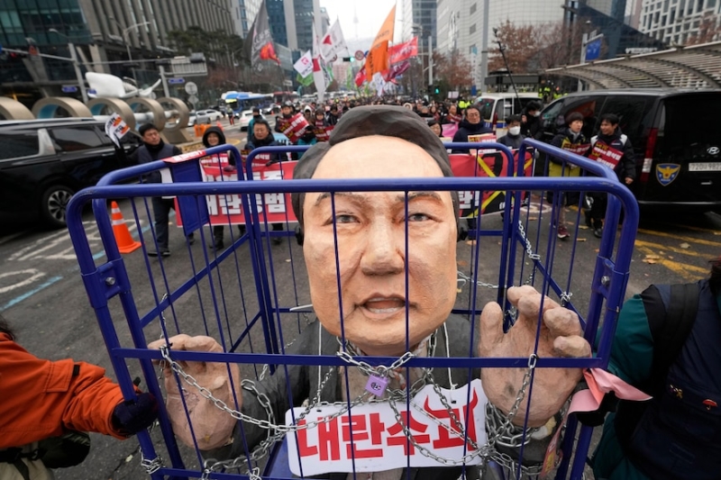 Impeached South Korean president issued with arrest warrant over martial law