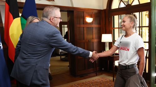 Grace Tame wears anti-Murdoch t-shirt to Australian of the Year morning tea