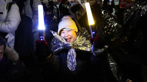 South Korean law enforcement officers detain impeached President Yoon