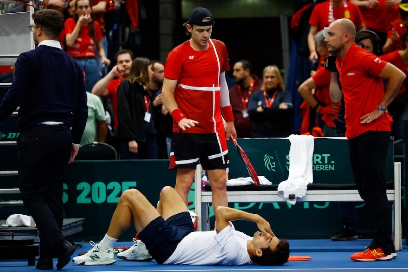 Belgium's Zizou Bergs knocks over Chilean Cristian Garin during Davis Cup tie