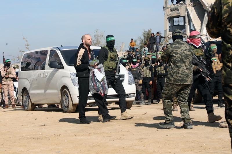 Freed Israeli hostage learns daughter's name, as released Palestinians burn shirts