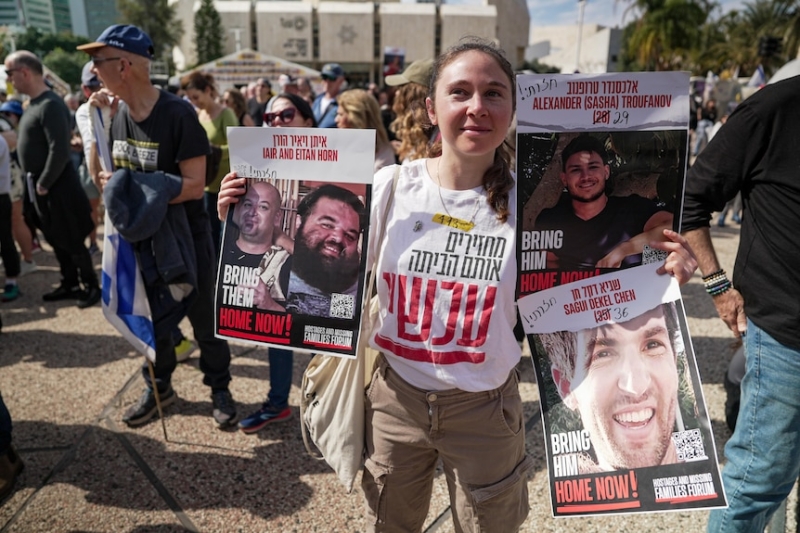 Freed Israeli hostage learns daughter's name, as released Palestinians burn shirts